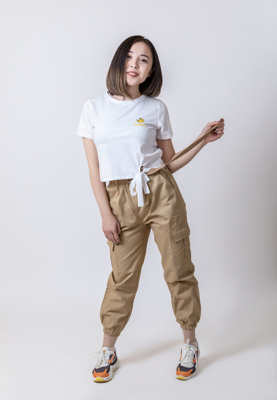 Woman in White Shirt and Beige Cargo Pants